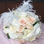 Vendela and Vivaldi Roses 
complimented with Ostrich Feathers and Pearls for a nostaglic look. 