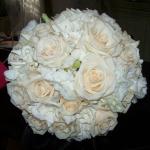 A very dramatic and fragrant mix of Champagne Rose, Ivory Lisianthus and  2 dozen Gardenias created  an elegant and gorgeous bouquet. 